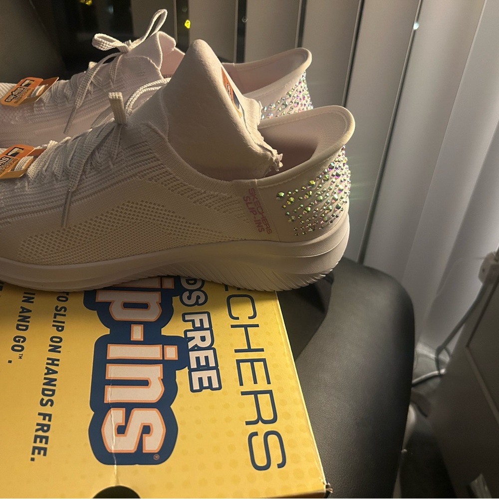 Skechers Women's White Slip-On Sneakers with Glitter Accents
